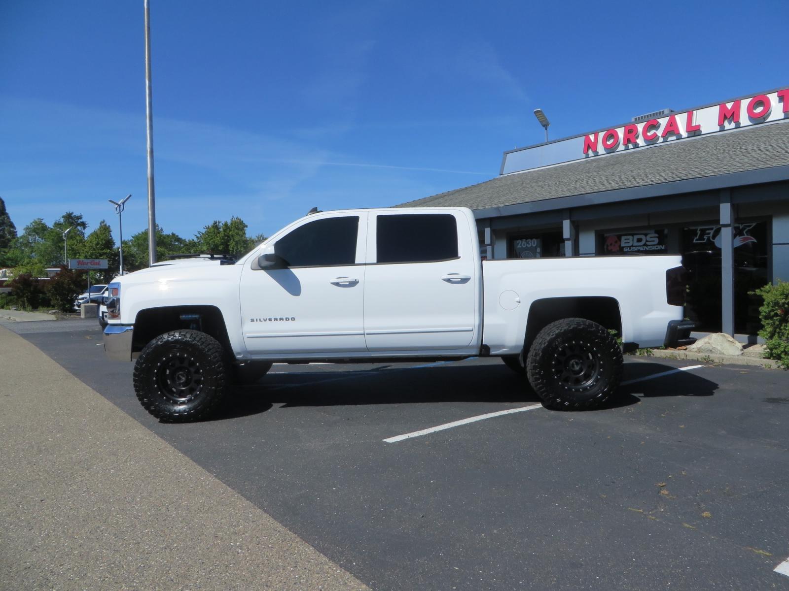 2018 White /BLACK Chevrolet Silverado 1500 LT (3GCPCREC7JG) with an 5.3L V8 OHV 16V engine, automatic transmission, located at 2630 Grass Valley Highway, Auburn, CA, 95603, (530) 508-5100, 38.937893, -121.095482 - Must see Pre Runner.... CST front lift spindals, Camburg UCA's, King Adjustable 2.5 Coil-overs, King 2.5 rear shocks, 35" Toyo RT Trail tires, 17" Method Race wheels, MZ front skid plate, G2 rear differntail cover, Full size bed mounted spare tire, Black Vinyl roof wrap, smoke tail lights and 3rd br - Photo #7
